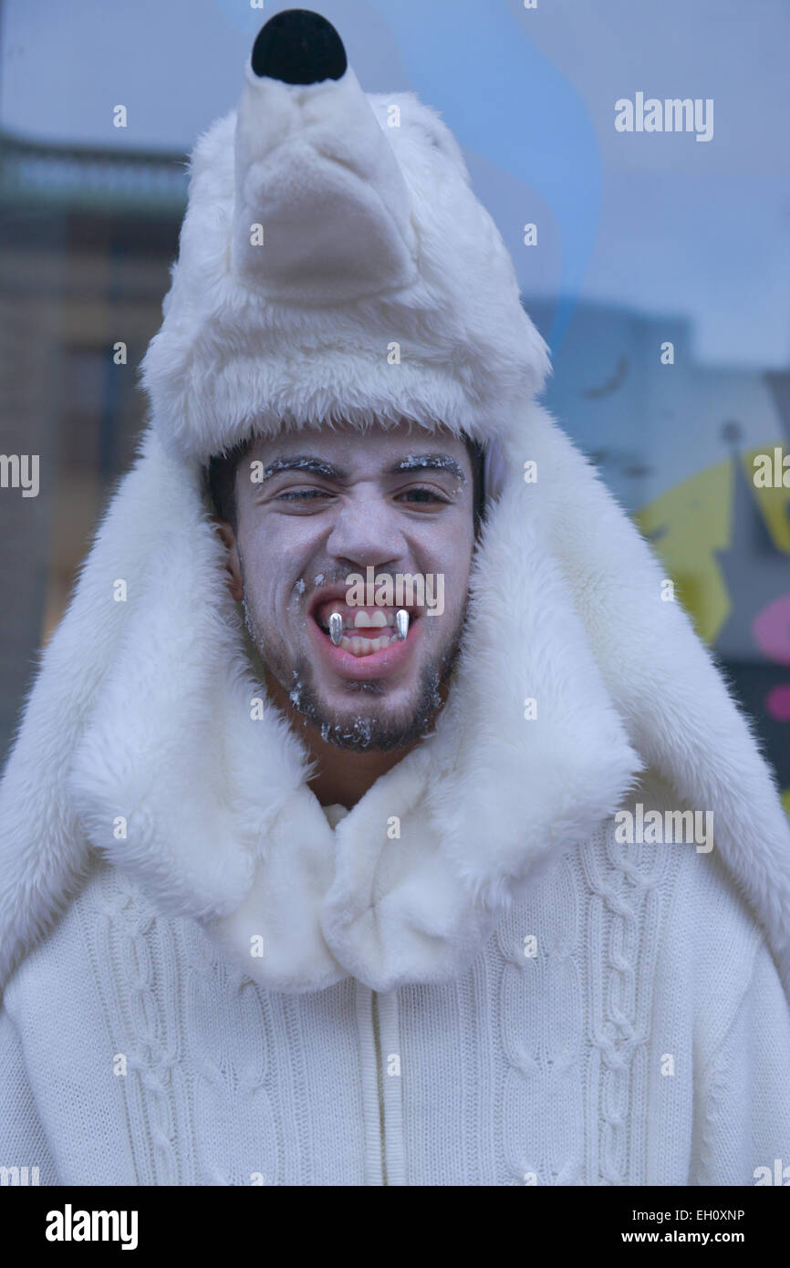 Man dressed up as a white wolf during Halloween in the streets of Newark, New Jersey USA. 2013. Stock Photo