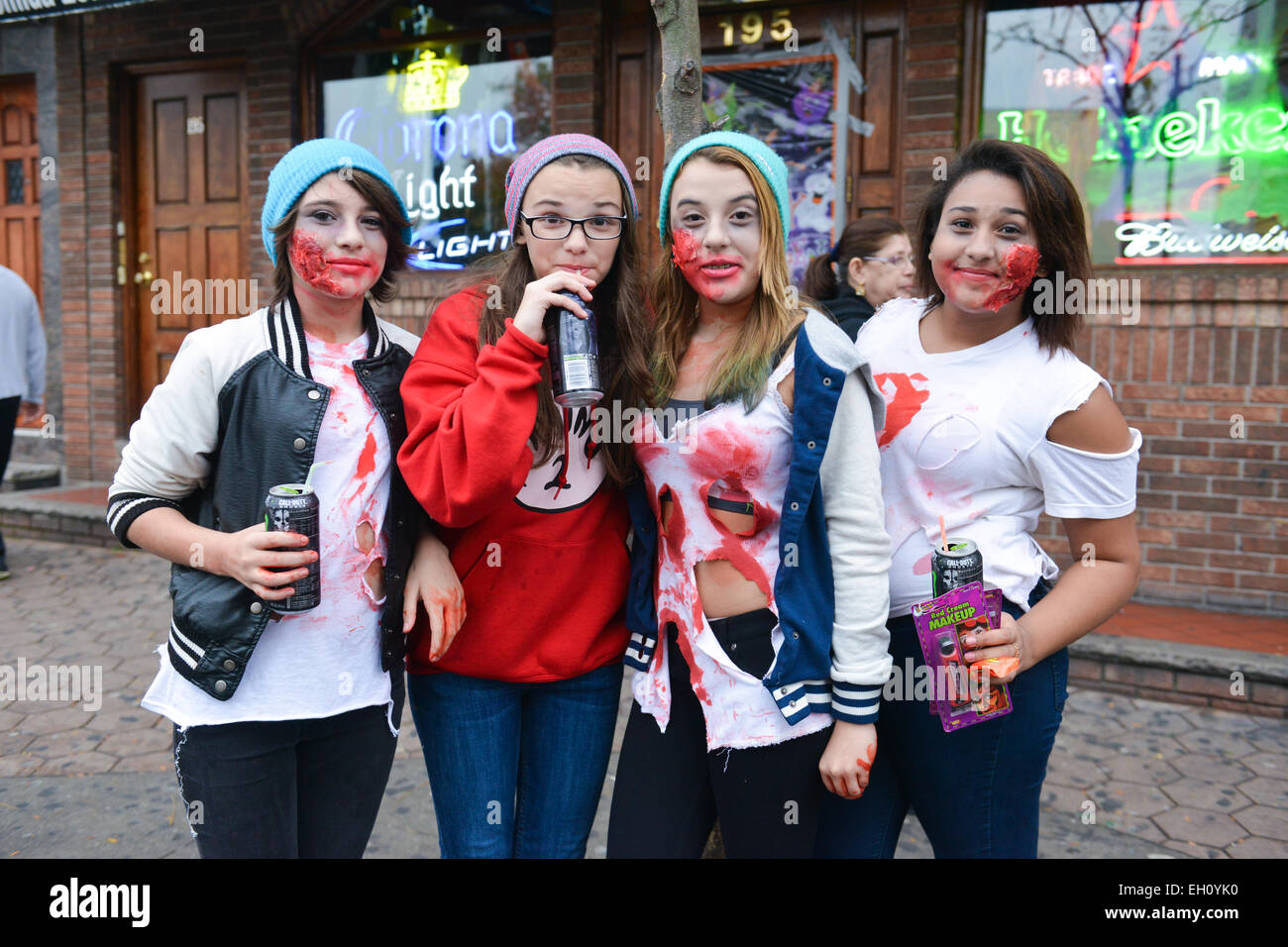 Four young teenage girls dressed up as zombies during the Halloween 2013 in the streets of Newark New Jersey. Stock Photo