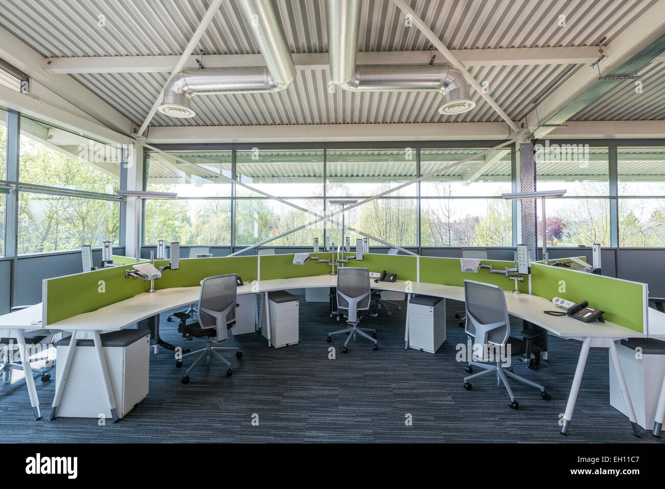 Modern office interior with open plan desking Stock Photo