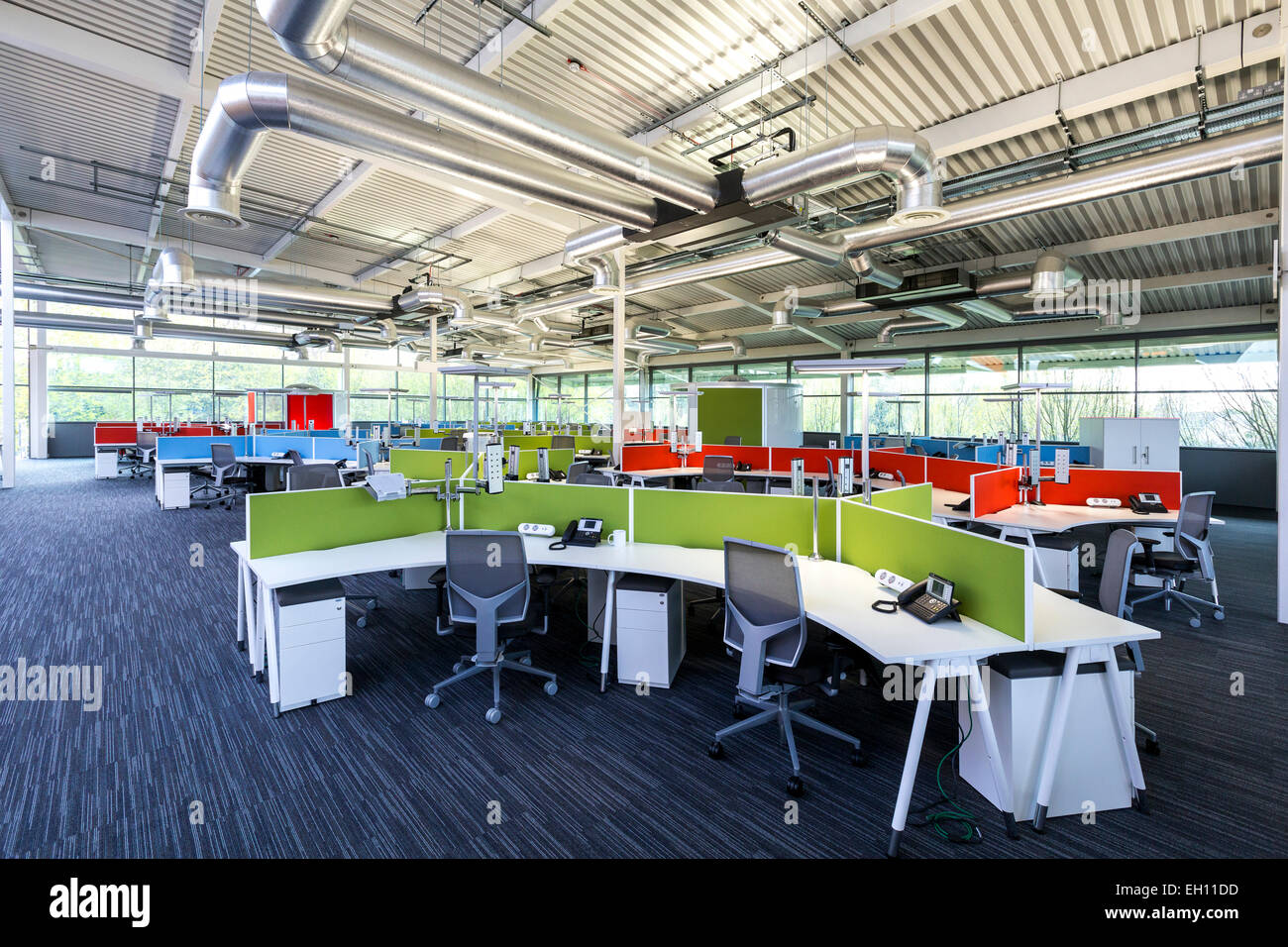Modern office interior with open plan desking Stock Photo