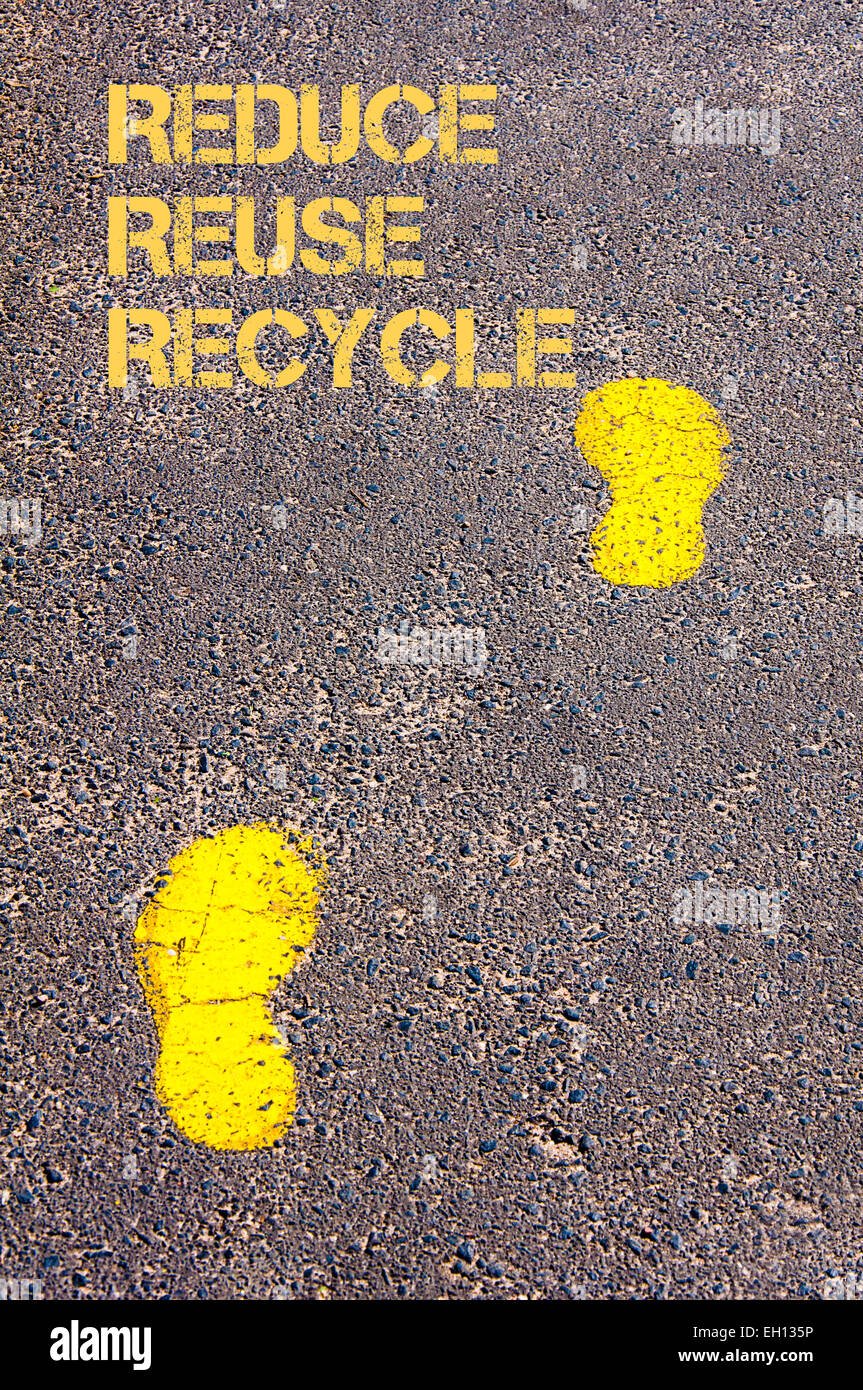 Yellow footsteps on sidewalk.Reduce Reuse Recycle message.Concept image ...