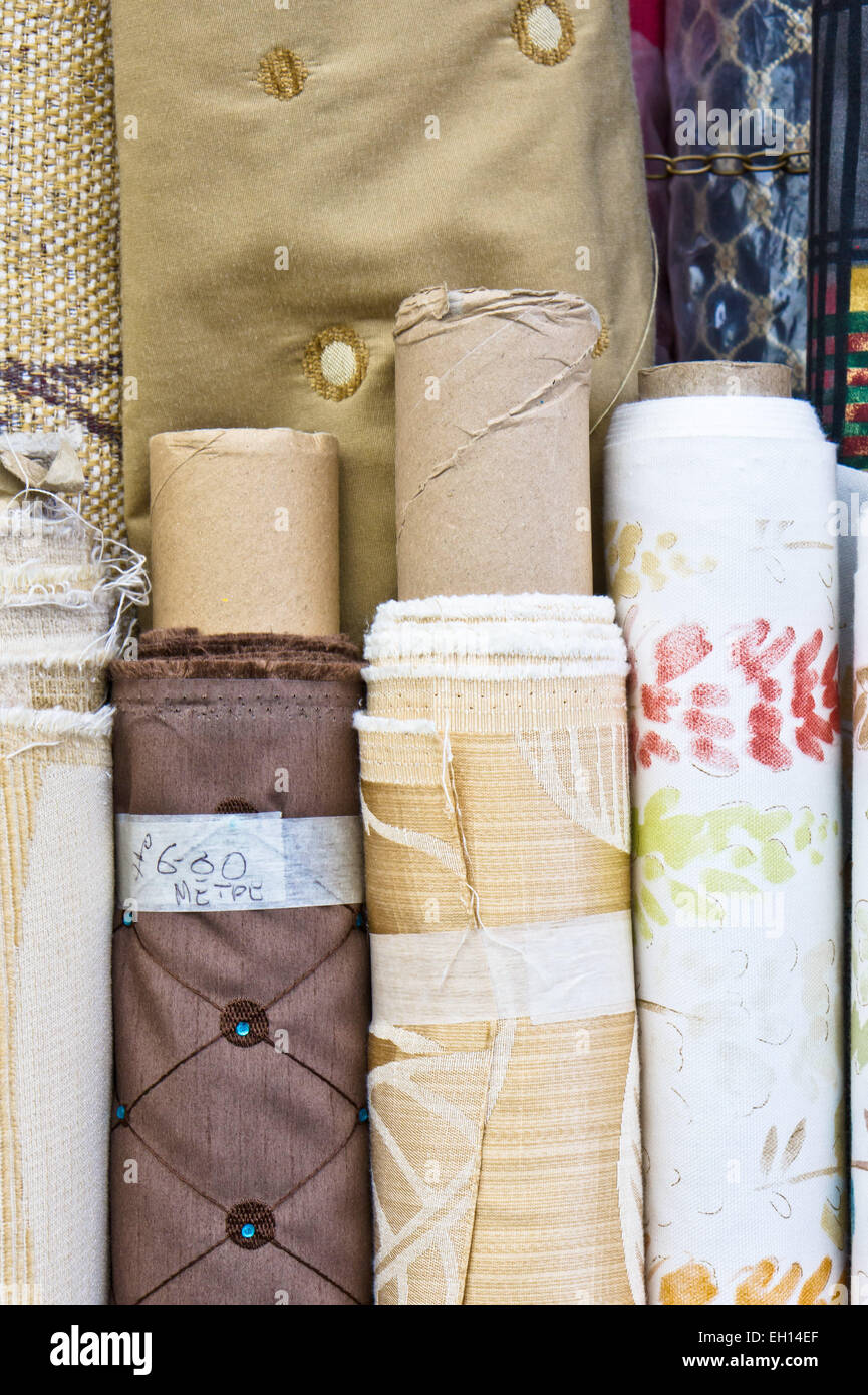 Rolls of brown and beige fabric at a market Stock Photo