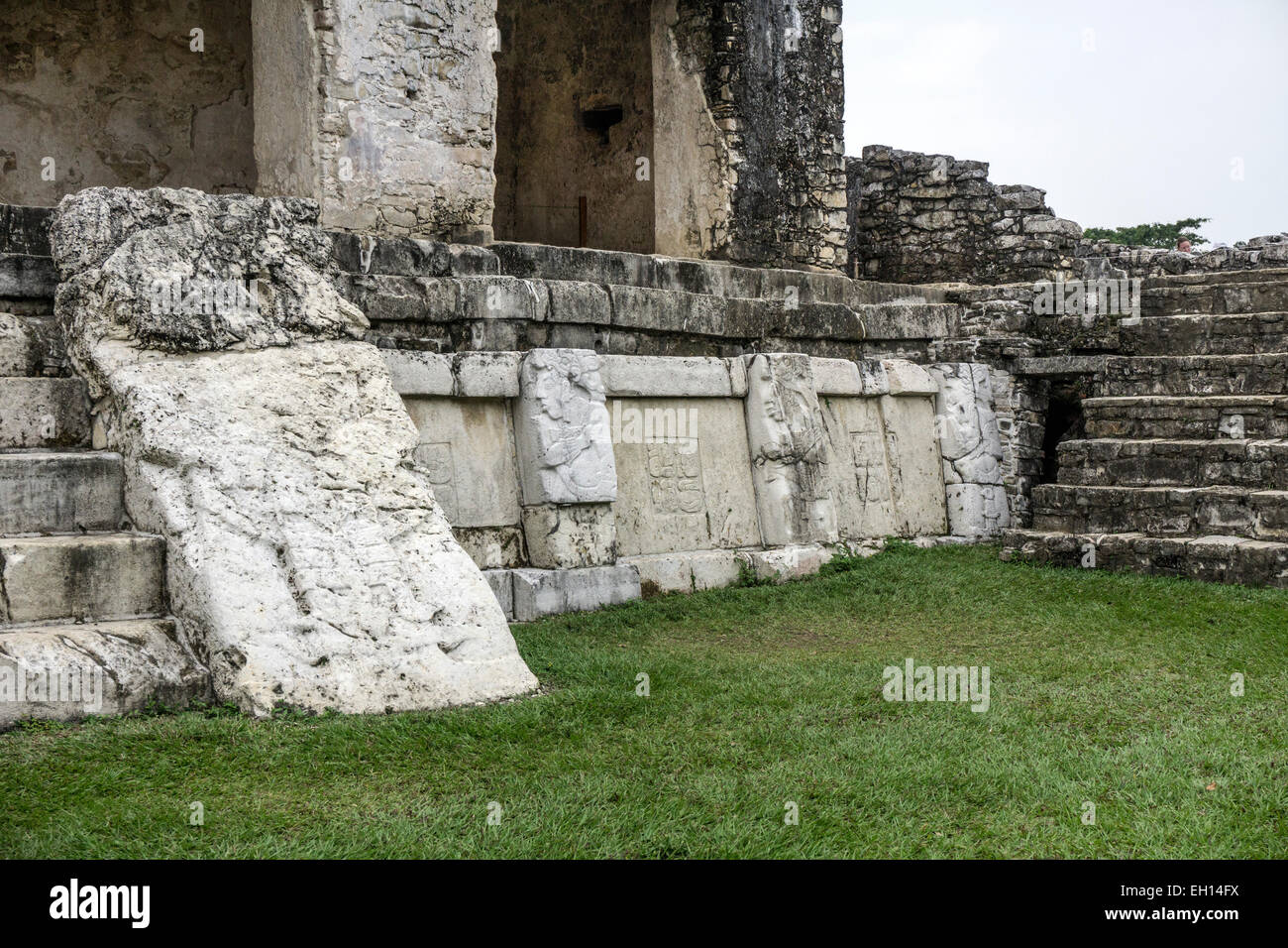 corner of east patio of Captured Chieftains with stone bas relief sculpture of captive warriors Mayan Palacio Palace complex Stock Photo