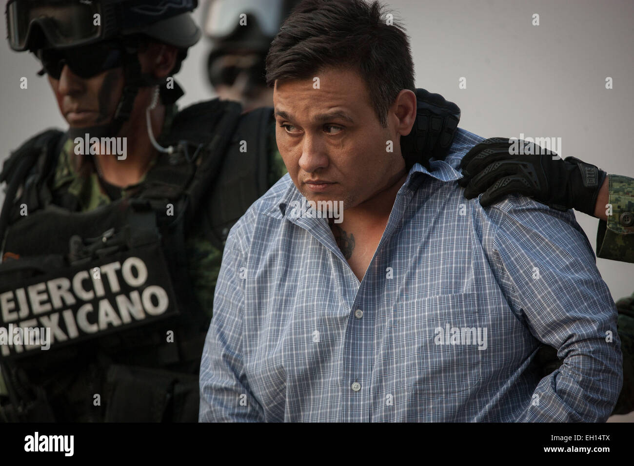 Mexico City, Mexico. 4th Mar, 2015. Mexican Army personnel escort Omar Trevino Morales (R) in Mexico City, capital of Mexico, on March 4, 2015. Mexican authorities on Wednesday arrested the head of the country's northern Los Zetas drug cartel, Omar Trevino Morales. © Pedro Mera/Xinhua/Alamy Live News Stock Photo