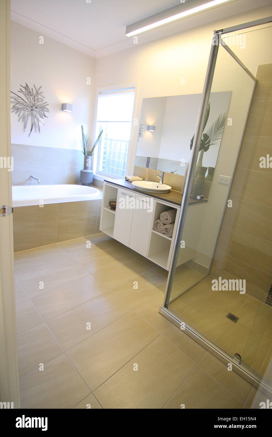 Modern bathroom with vanity and bath tub Stock Photo
