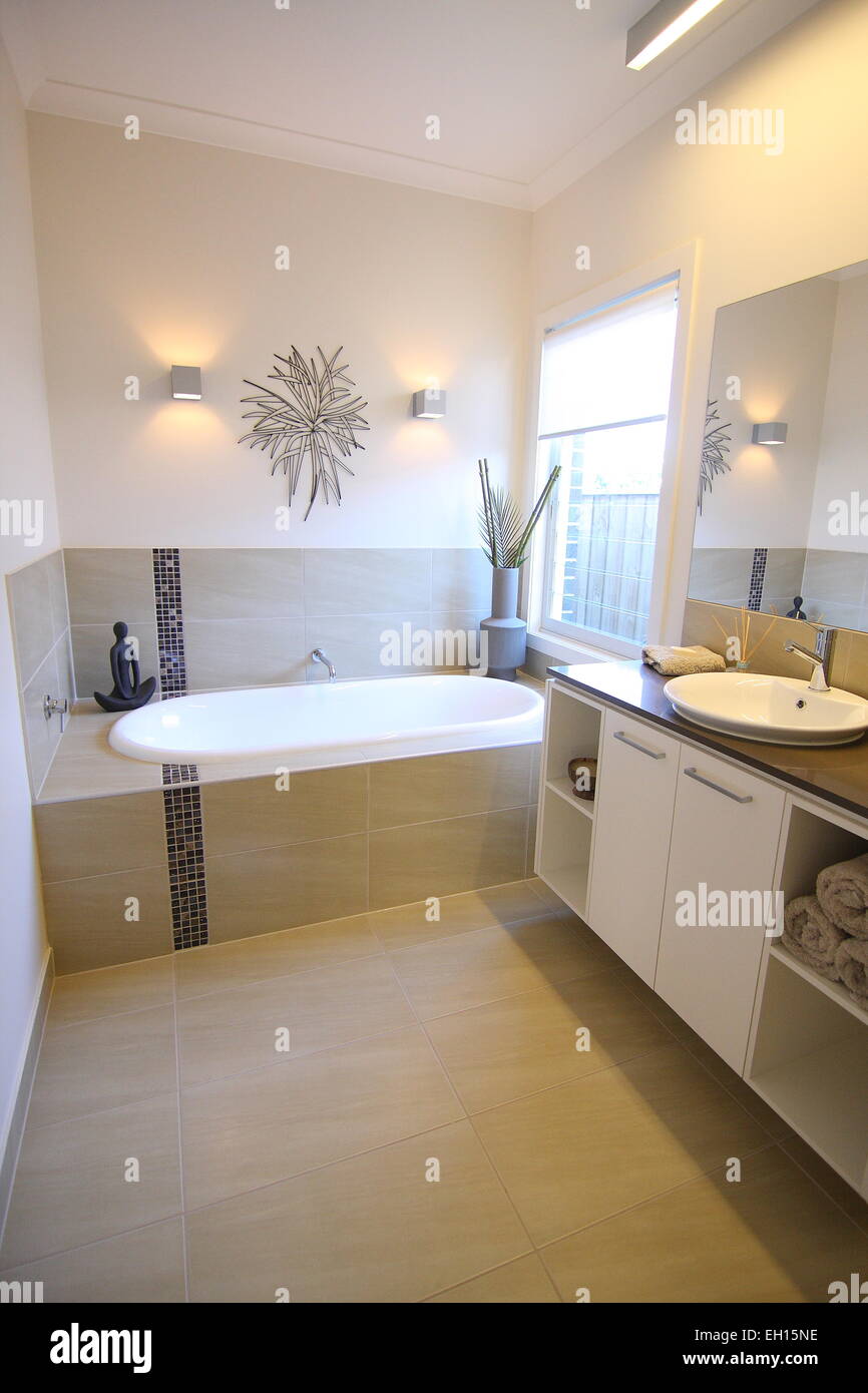 Modern bathroom with vanity and bath tub Stock Photo