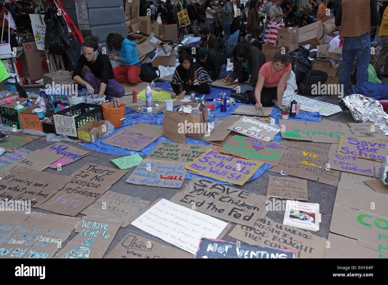 Painted placards displayed on the sidewalk at the Occupy Wall Street protest in Zuccotti Park, New York Stock Photo