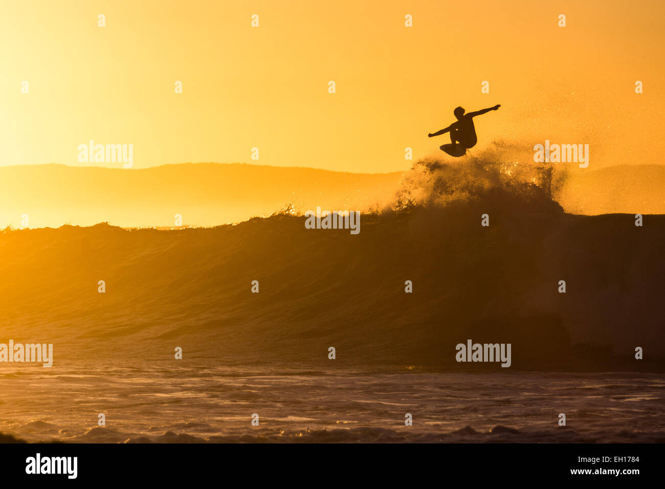 Surfer Rising Sun Surfer during sunrise Stock Photo - Alamy