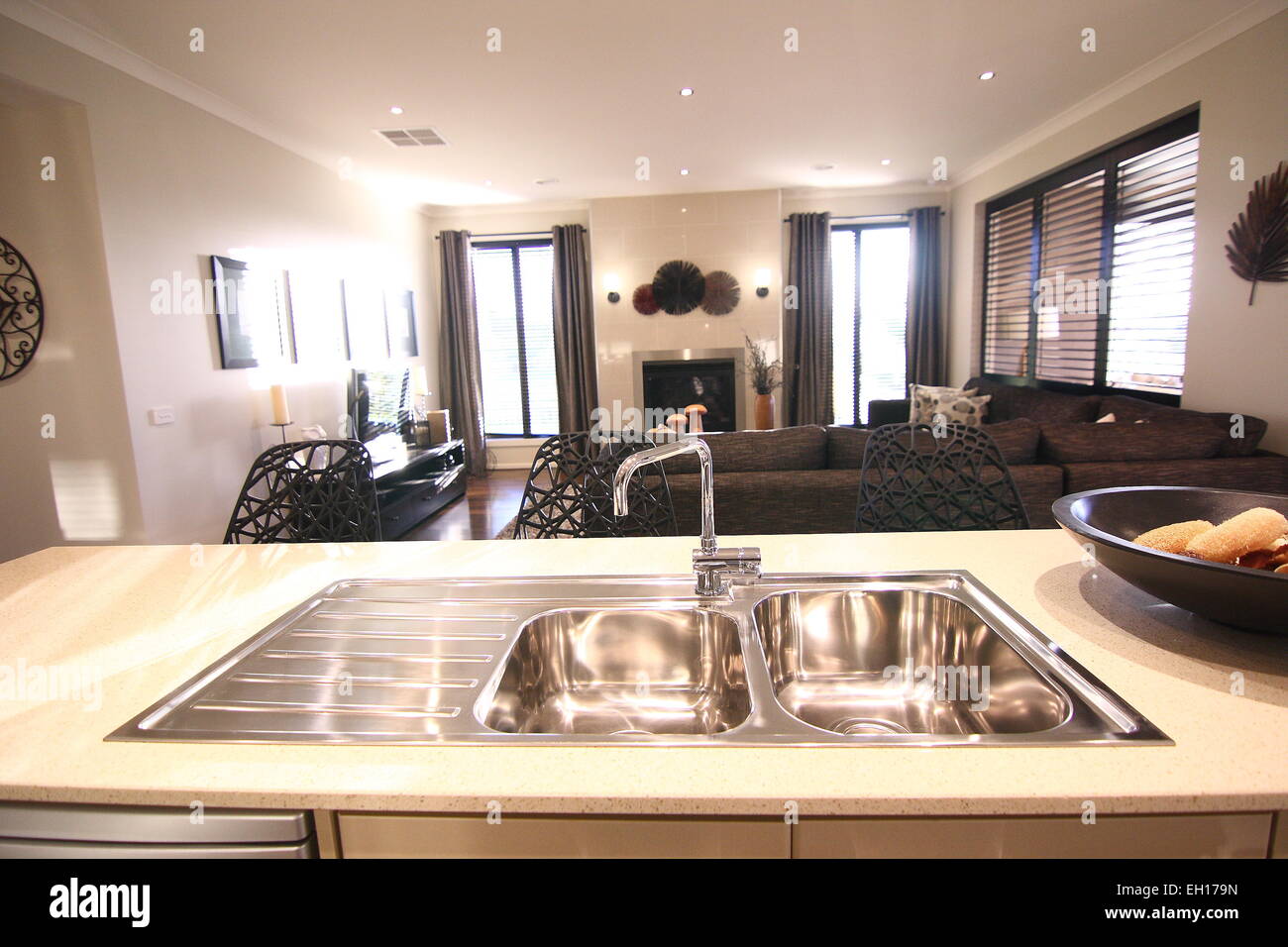 Modern living room and White Kitchen with wooden flooring Stock Photo ...