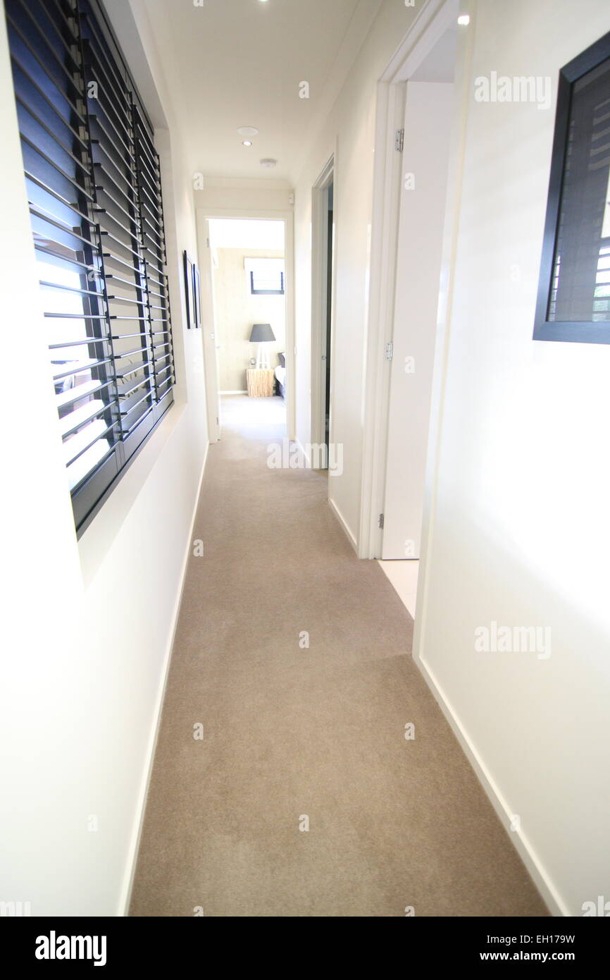 Hallway of a new modern home with carpet flooring Stock Photo