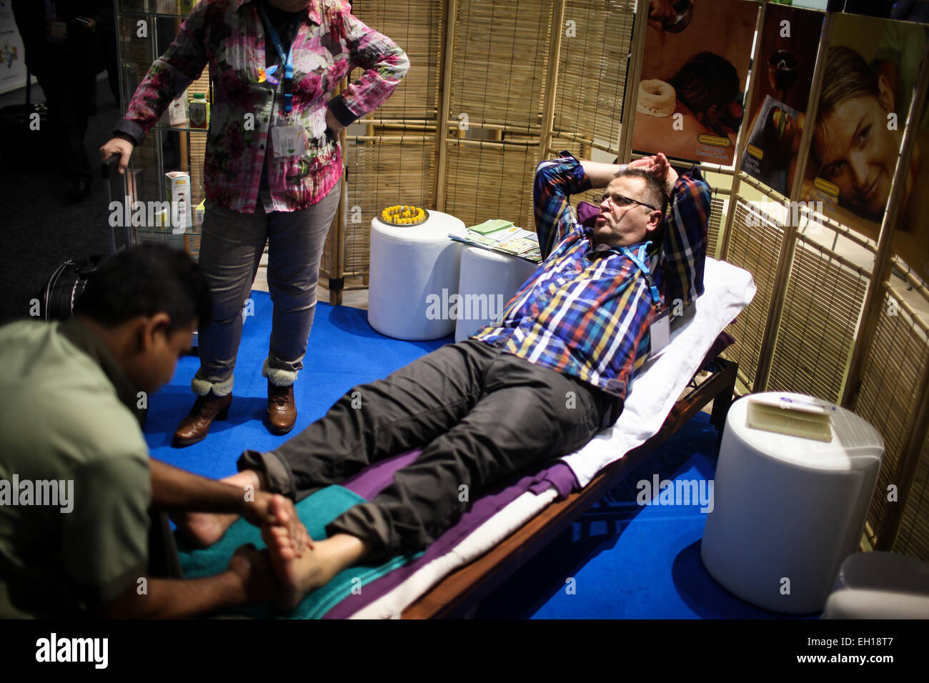 Berlin, Germany. 4th Mar, 2015. A visitor enjoys foot massage at the stand  of Sri Lanka during the Berlin International Tourism Fair (ITB), in Berlin,  Germany, on March 4, 2015. ITB, one