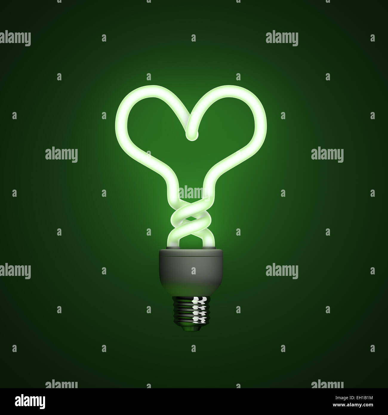Energy saving compact fluorescent lightbulb, lamp on a green background with fine illumination Stock Photo