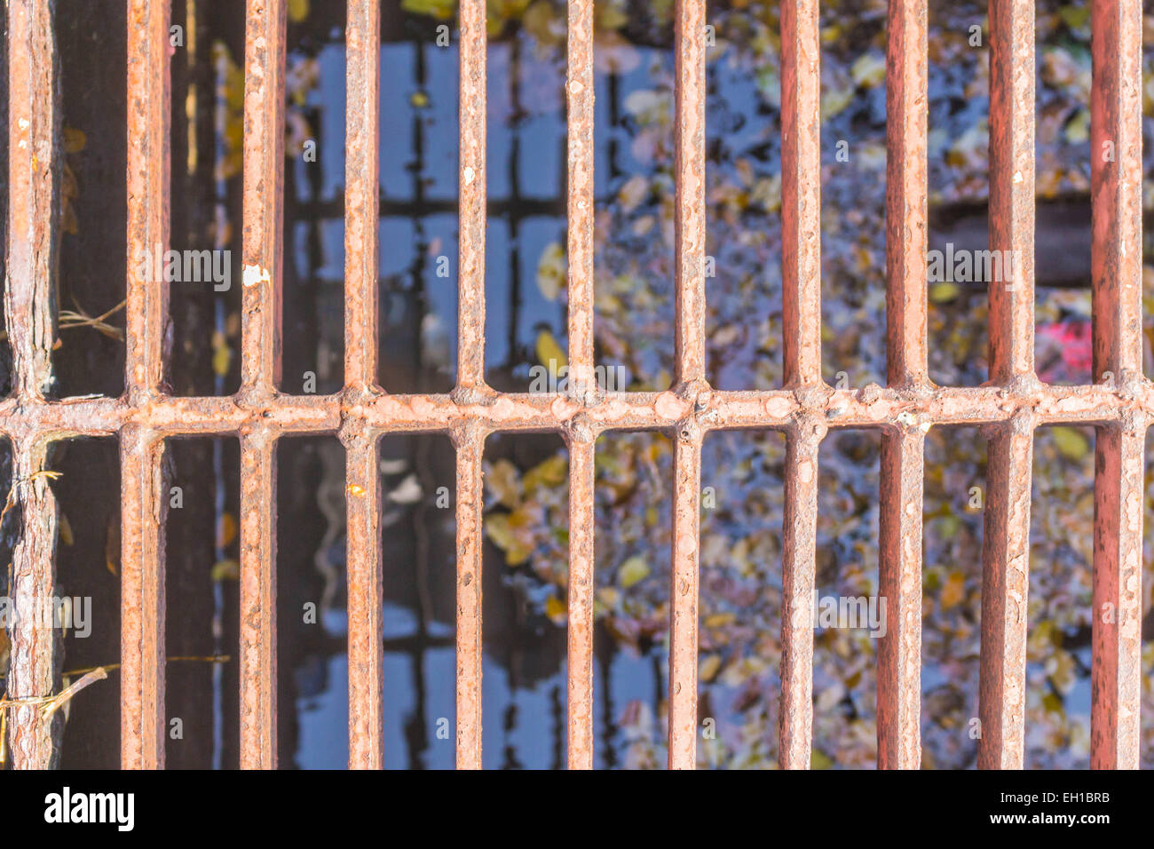 Steel grating cover off the old rusty pipes. Stock Photo