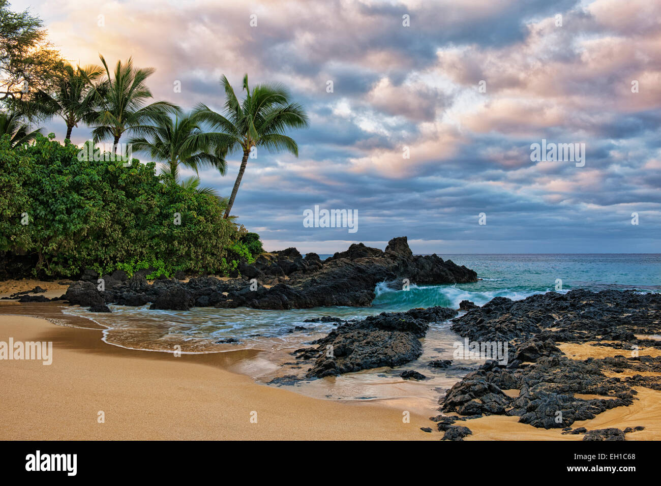 First light reveals the beauty of secluded Wedding Beach on Hawaii’s island of Maui. Stock Photo