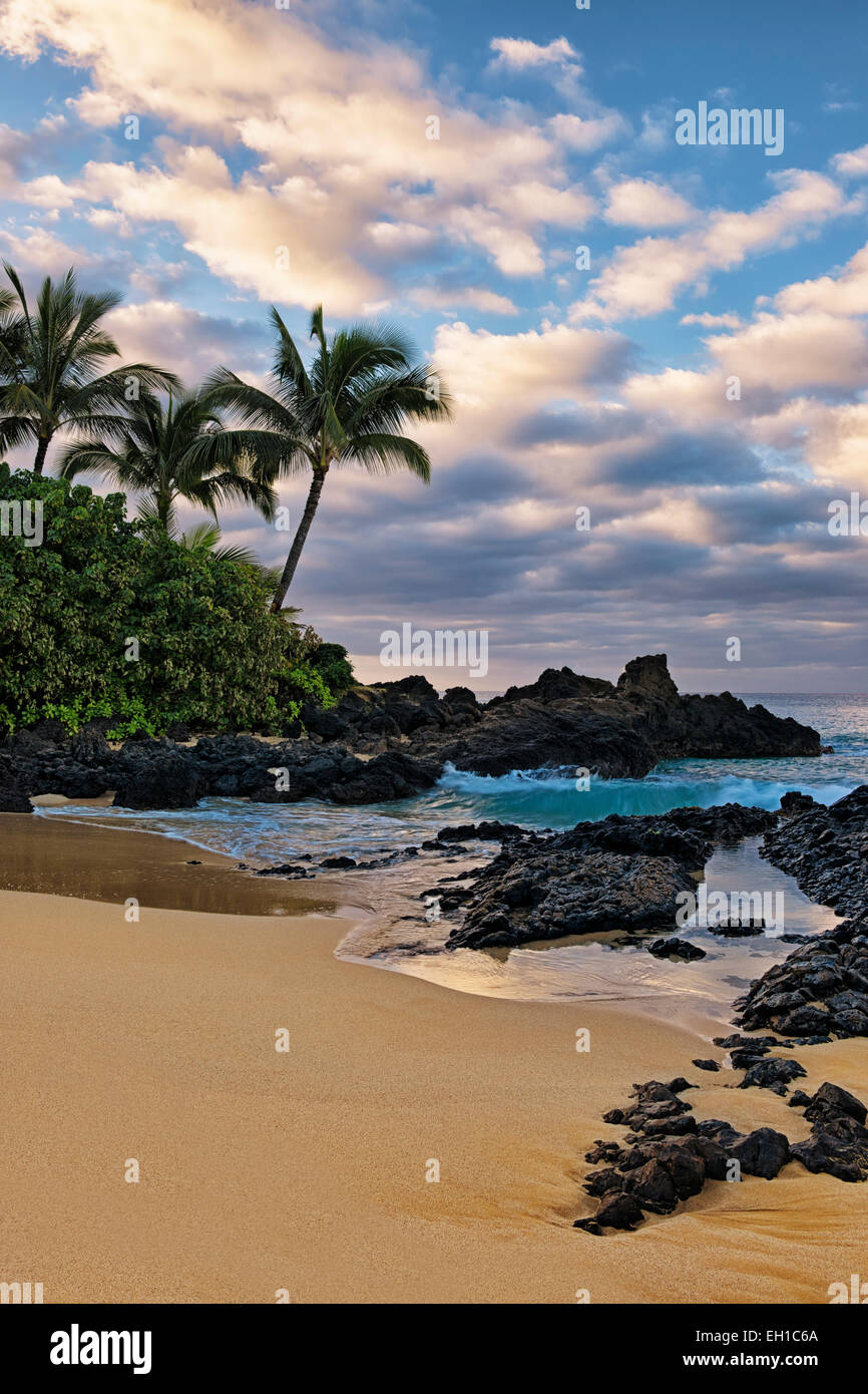 First light reveals the beauty of secluded Wedding Beach on Hawaii’s island of Maui. Stock Photo