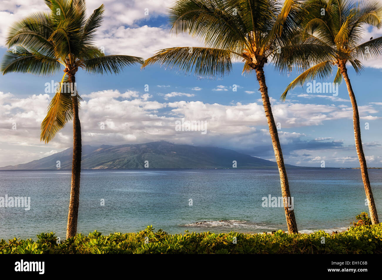 Late afternoon clouds build over the West Maui Mountains from Makena Point on Hawaii’s island of Maui. Stock Photo