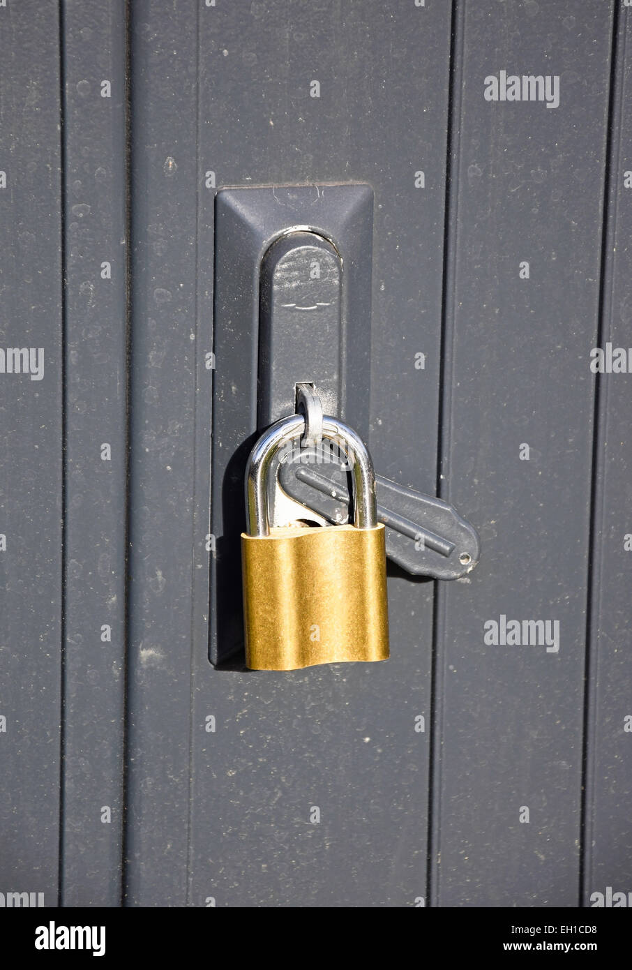 Padlock on a metal door Stock Photo Alamy