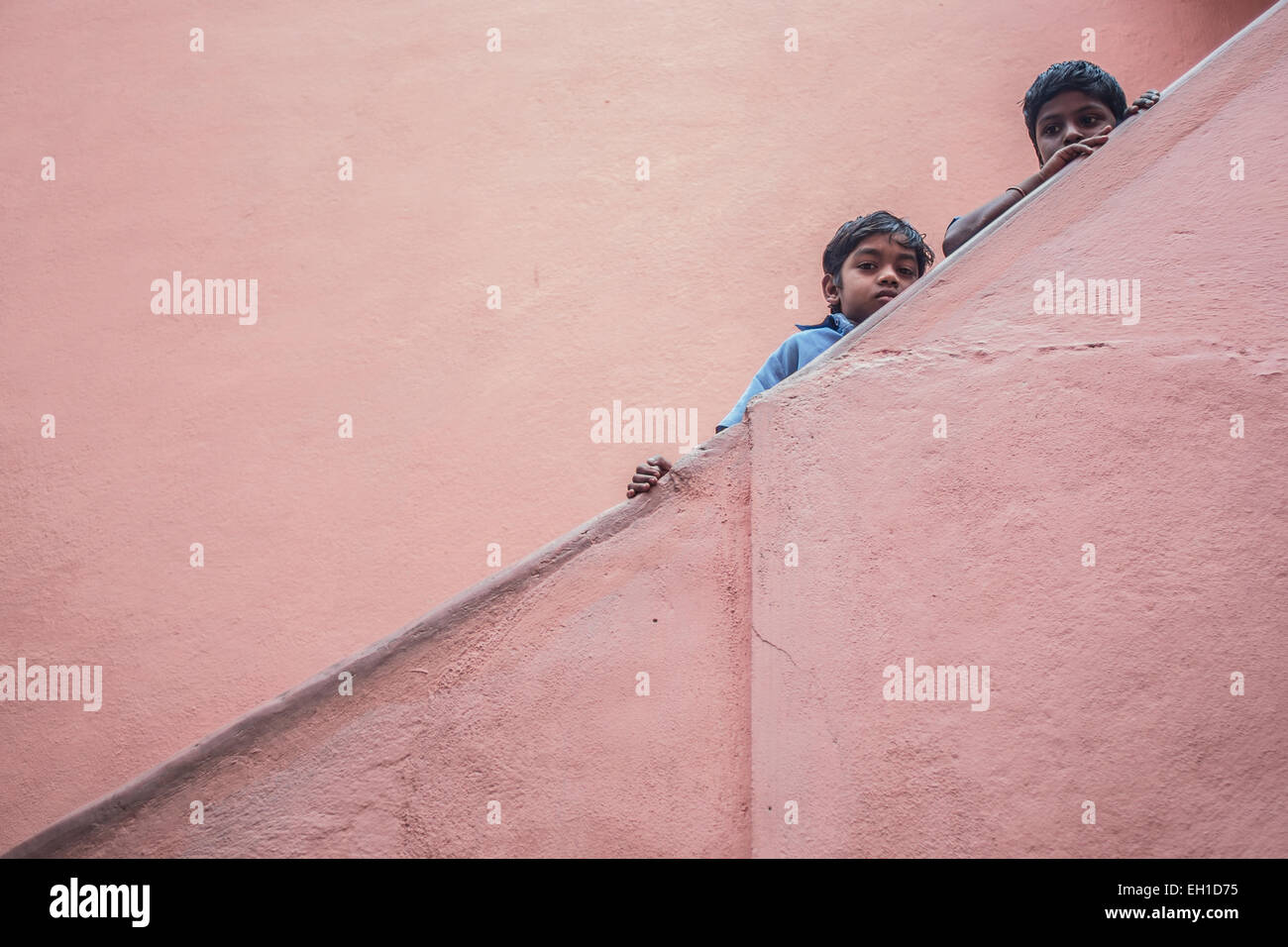 Two school children at a Indian government school in Bangalore standing in a staircase. Stock Photo