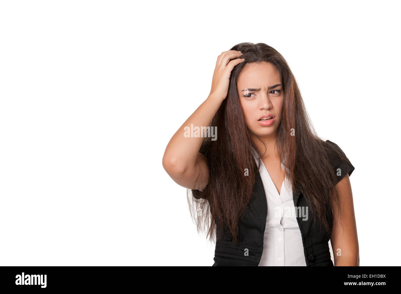 Portrait of puzzled young woman, isolated on white Stock Photo