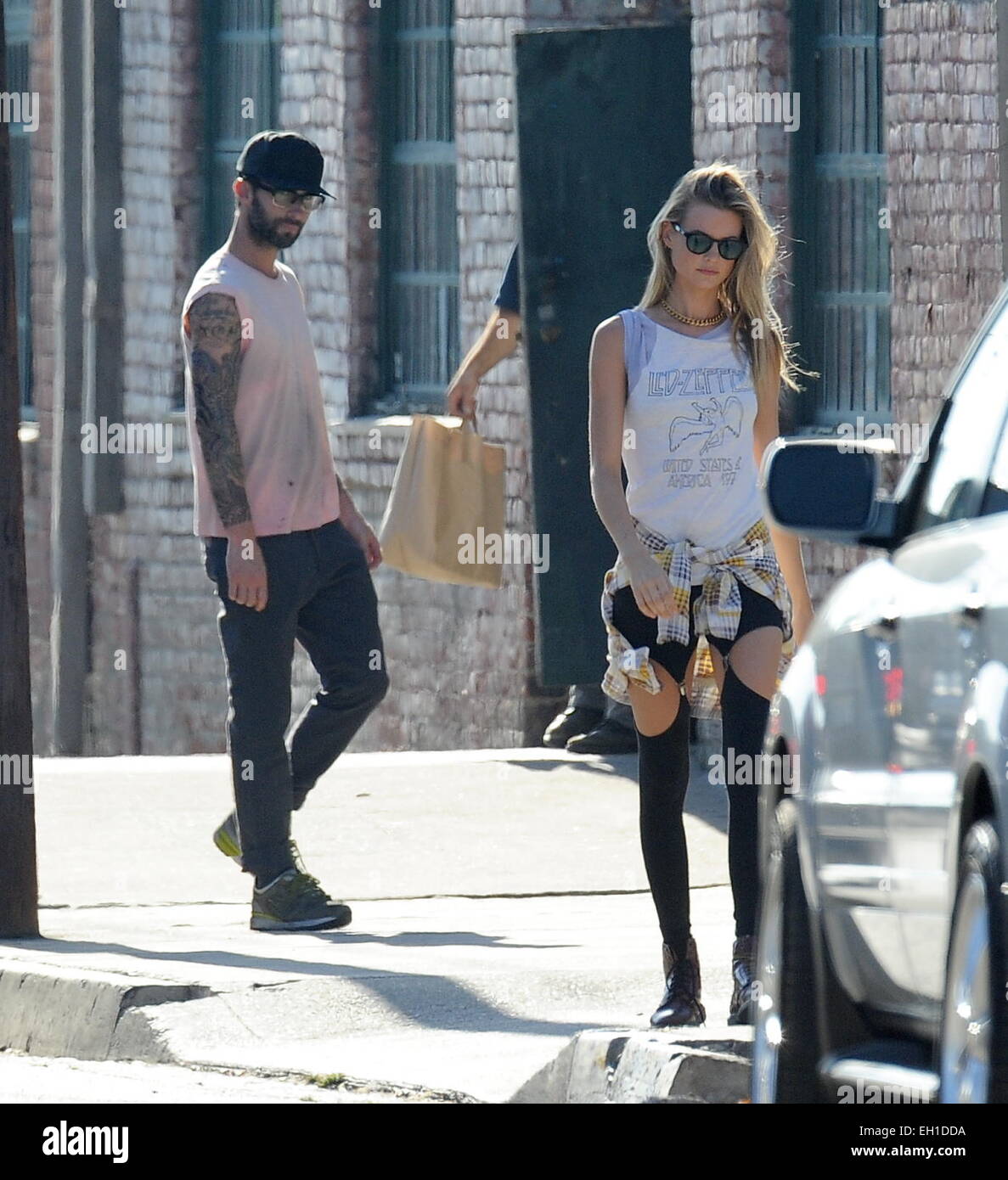 Adam Levine and wife Behati Prinsloo on the set of Maroon 5's music video  for their next single 'Animals' Featuring: Adam Levine,Behati Prinsloo  Where: Los Angeles, California, United States When: 30 Aug