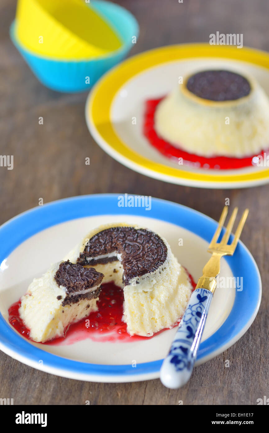 Mini Cheesecakes  with biscuit and raspberries jam Stock Photo
