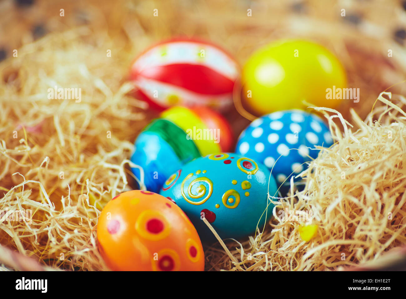 Close-up of painted Easter eggs in a nest Stock Photo - Alamy