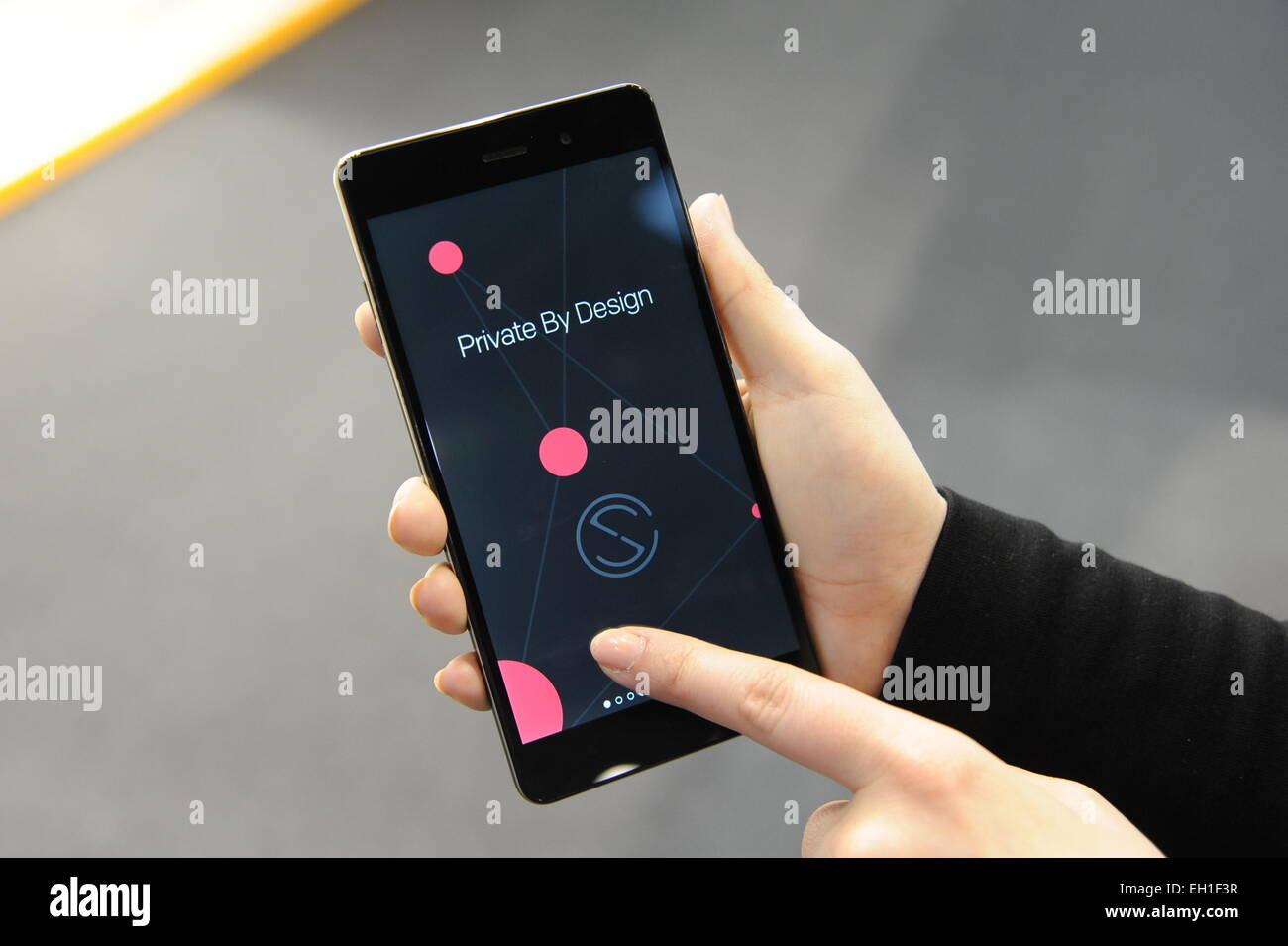 A staff member of Silent Circle presents a prototype of the new smartphone ' Blackphone 2' during the mobile industry and communications fair Mobile  World Congress in Barcelona, Spain, 3 March 2015. With
