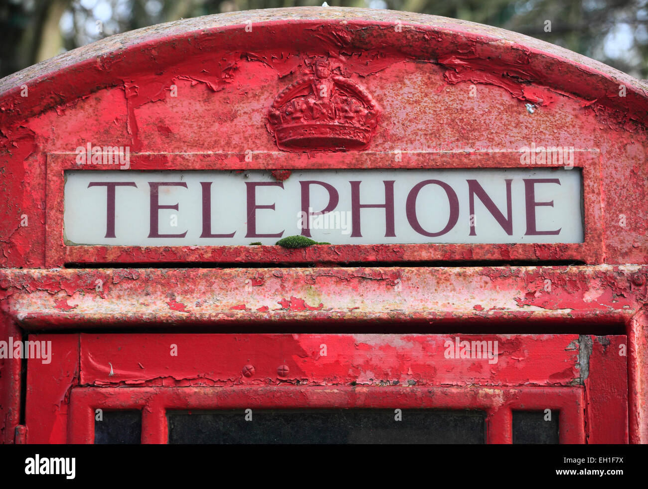 Traditional red telephone box in a rural Norfolk village. Stock Photo