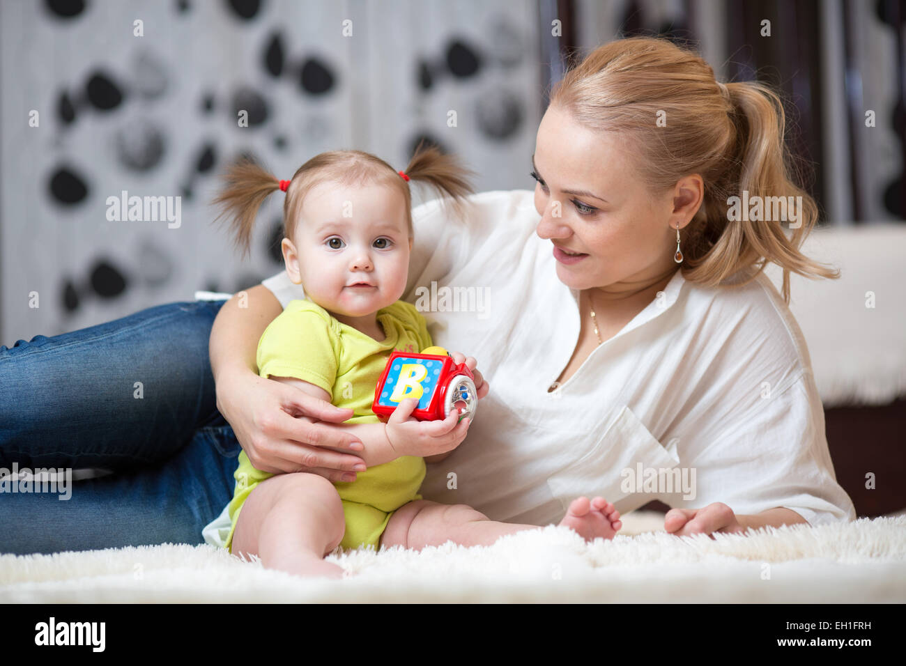 mother with his child girl play together Stock Photo