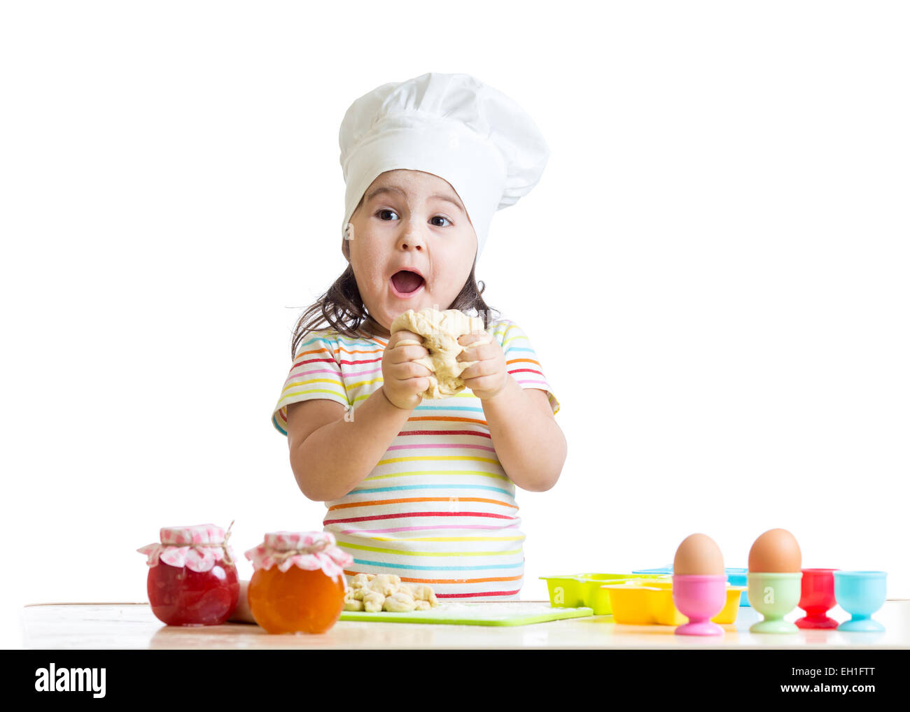 little girl kneading dough Stock Photo