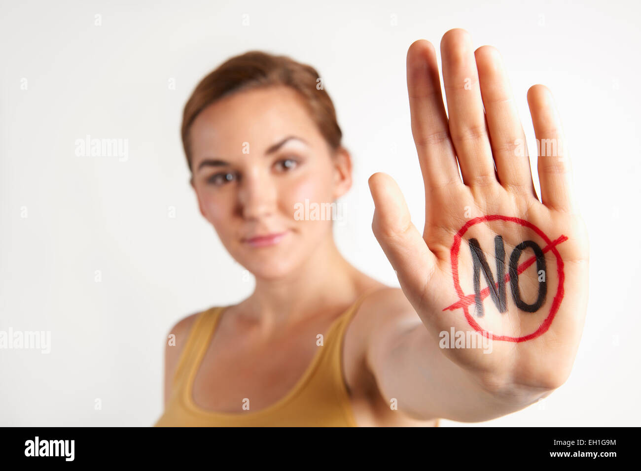 Female Protester With 'No' Written On Palm Stock Photo