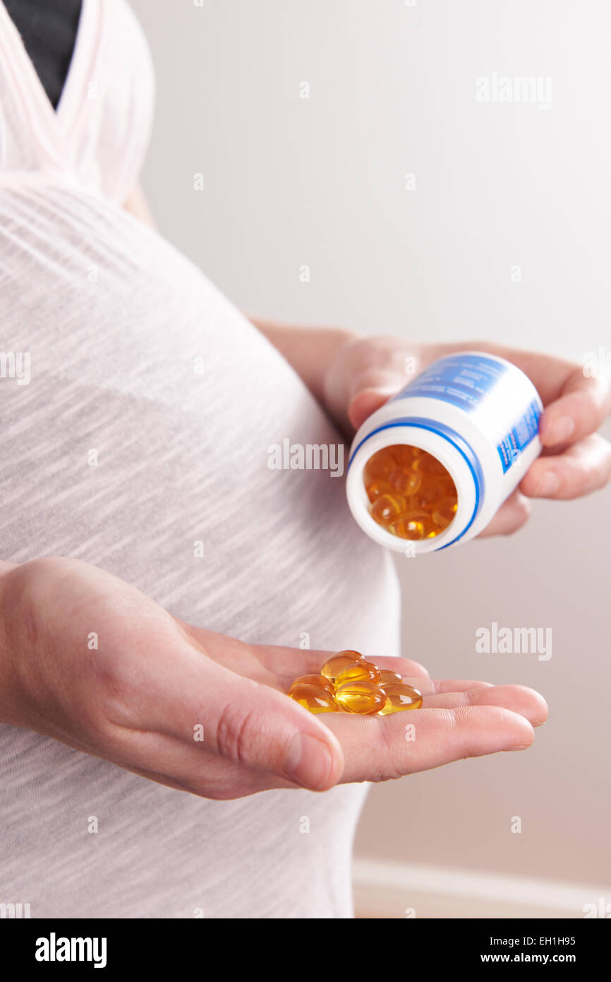 Detail Of Pregnant Woman Taking Vitamins Stock Photo Alamy
