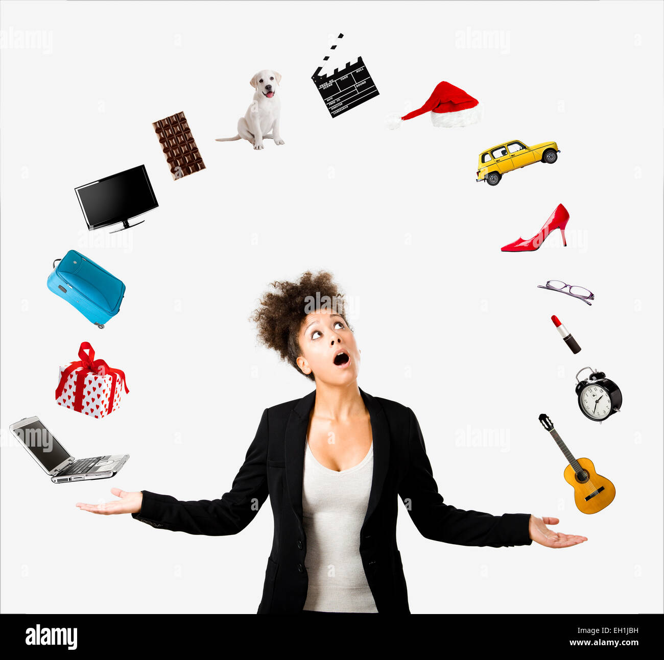 A Beautiful AfroAmerican woman juggling multiple objects over the air