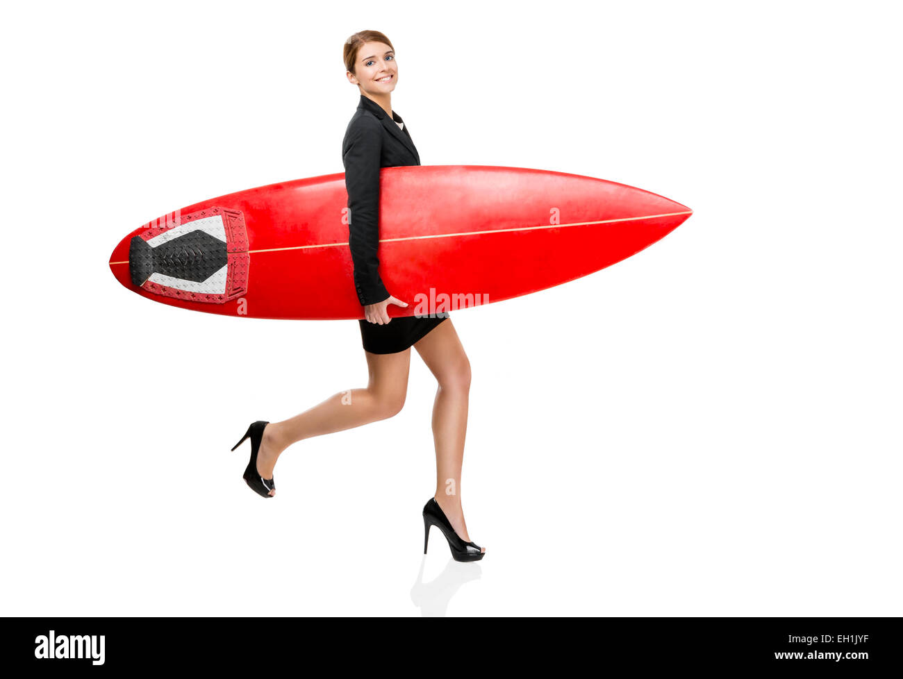 Business woman holding a surfboard, isolated on white background Stock Photo