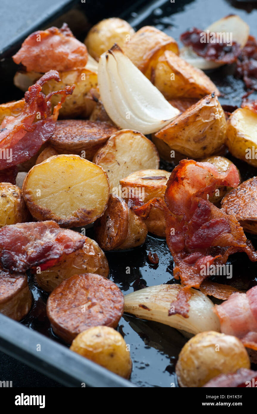 Oven roasted bacon, onion and potato Stock Photo - Alamy
