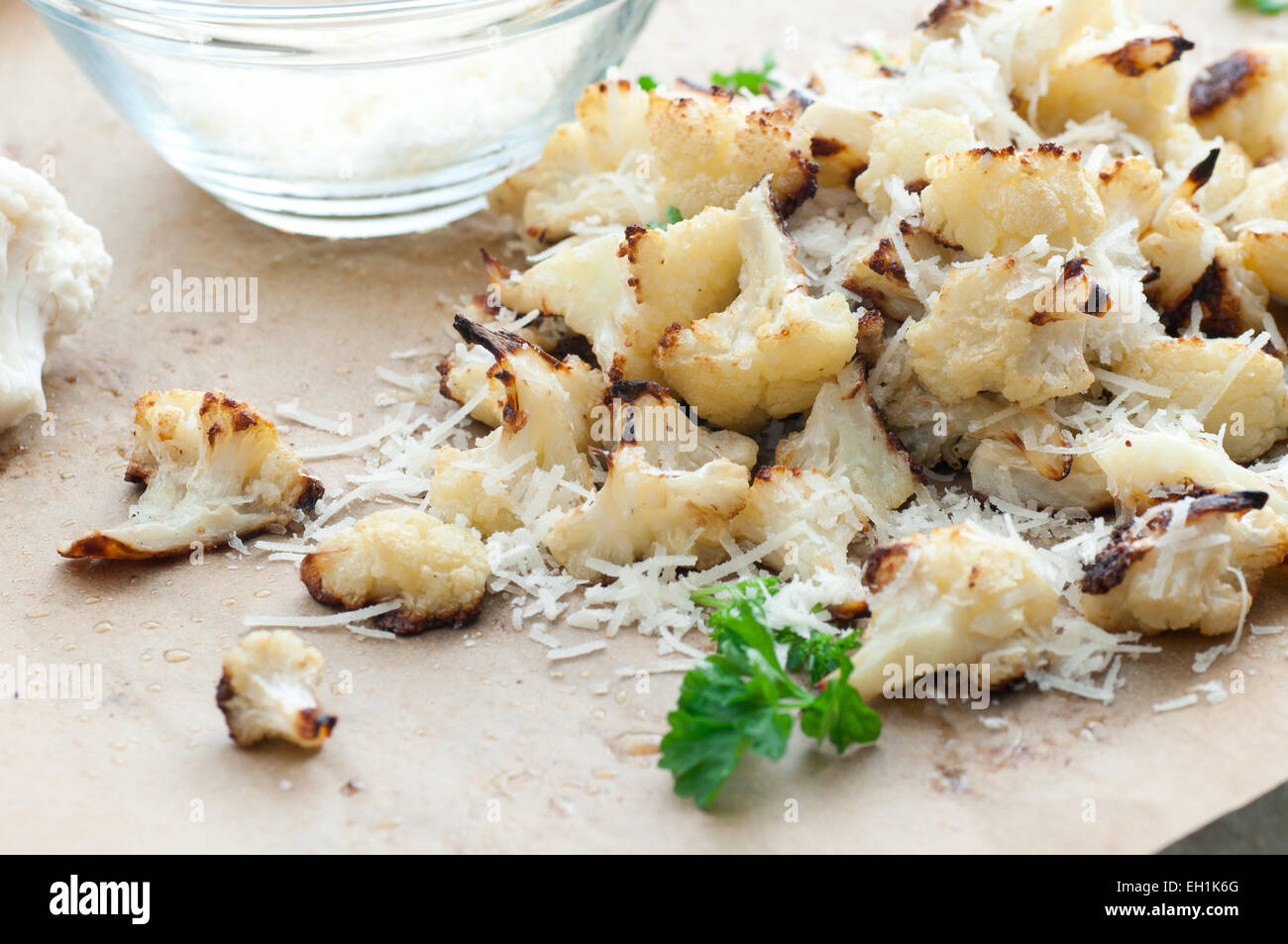 Roasted cauliflower served with parmesan and parsley. Stock Photo