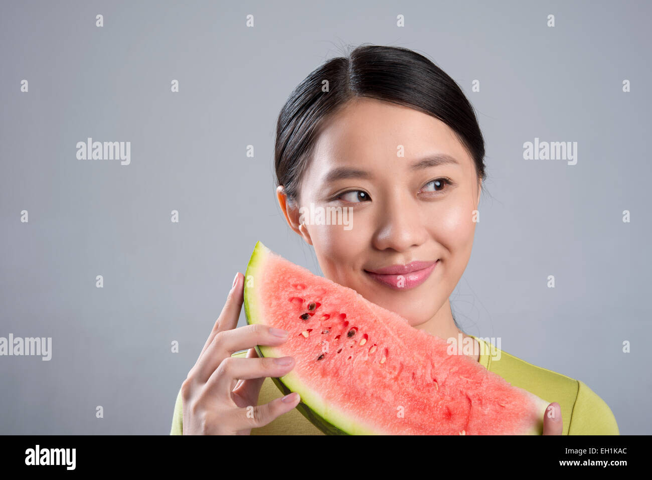 Young woman eating watermelon Stock Photo