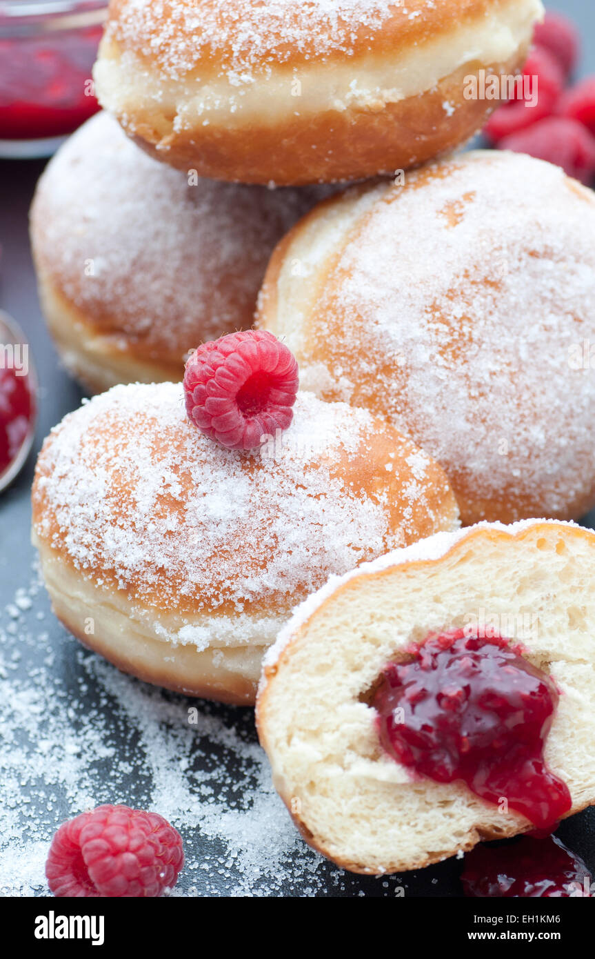 Fresh donuts filled with raspberry preserves. Stock Photo