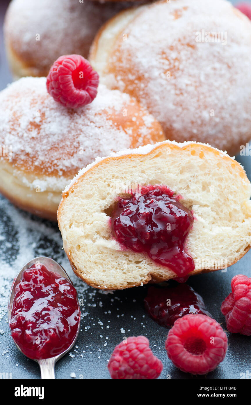 Fresh donuts filled with raspberry preserves. Stock Photo