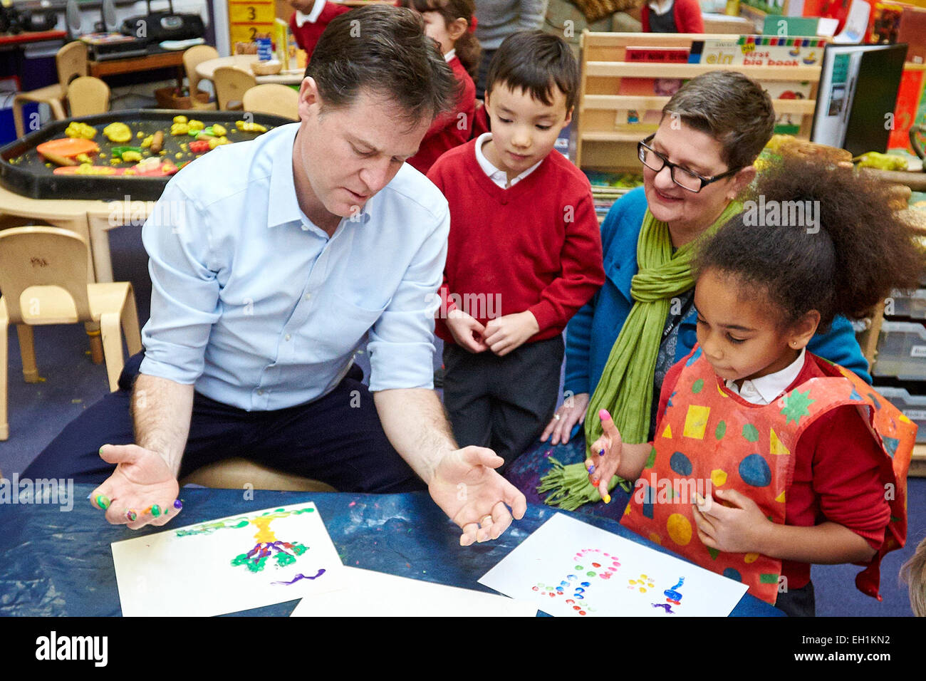 Liberal democrat leader Nick Clegg takes part in finger painting at Botley school during a visit to launch the party's manifesto Stock Photo