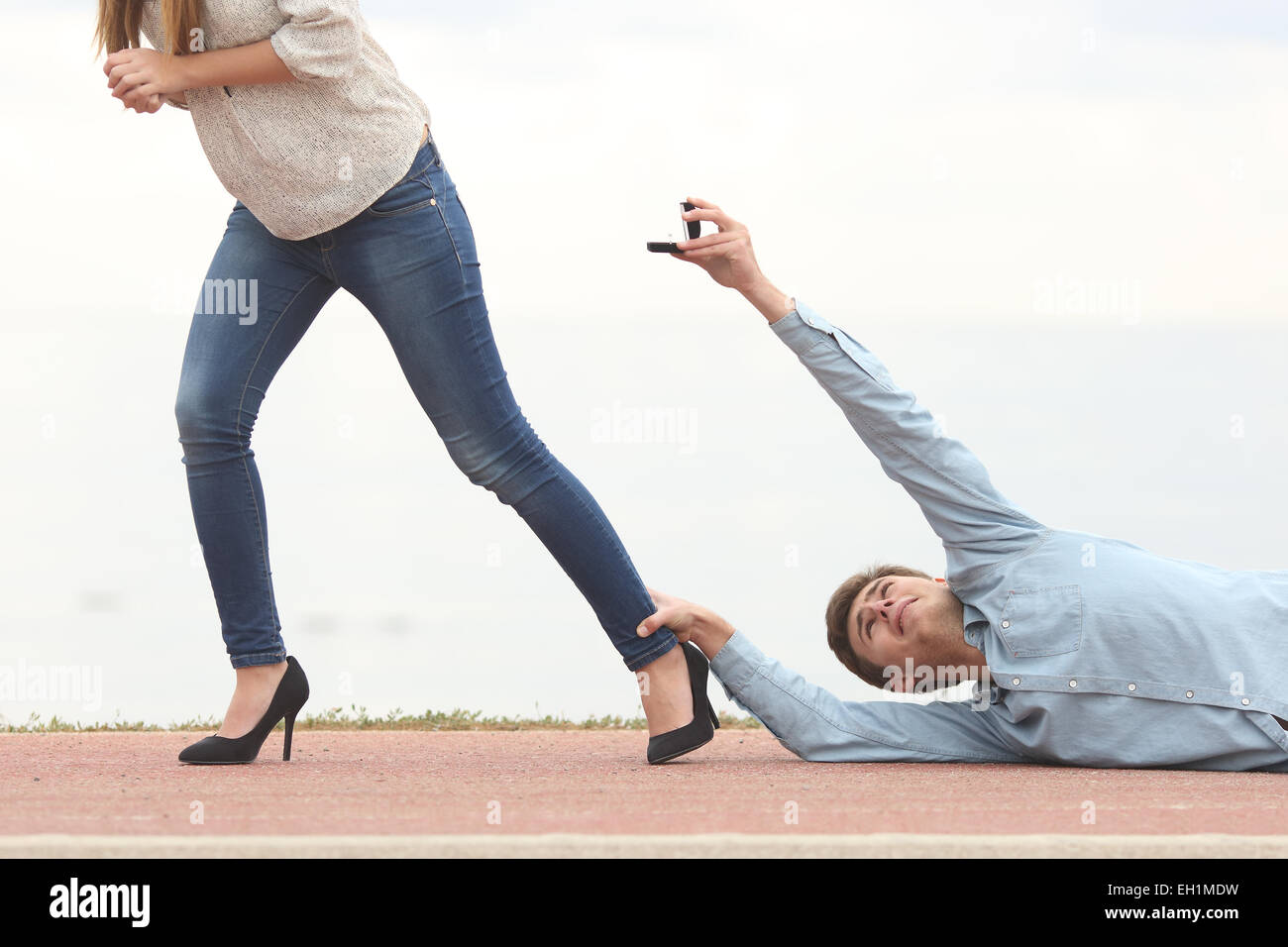Man being rejected by his girlfriend when is proposing marriage Stock Photo