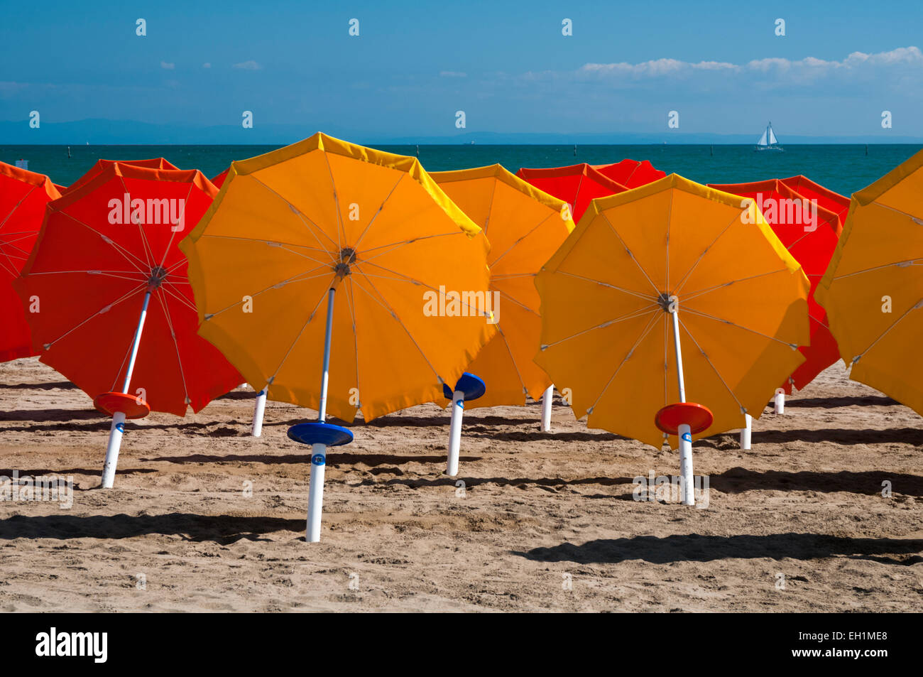 Colorful umbrellas on sandy beach in Lignano Sabbiadoro, Italy, Europe Stock Photo