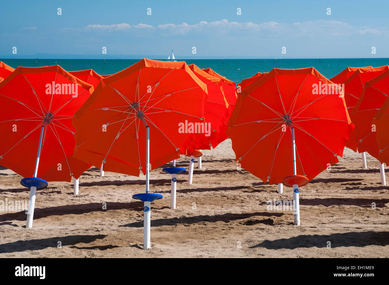 Colorful umbrellas on sandy beach in Lignano Sabbiadoro, Italy, Europe Stock Photo