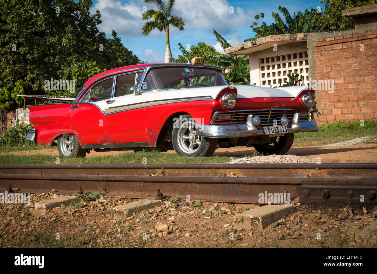 1957 Ford Fairlane classic Americana beside the railway track in Trinidad Cuba. Stock Photo