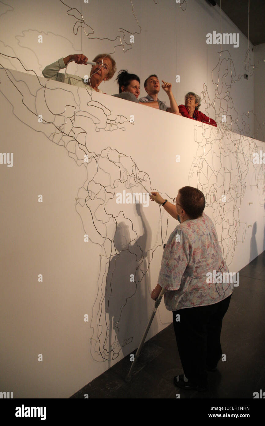 Visually impaired people at art exhibition at Nottingham Art Exchange