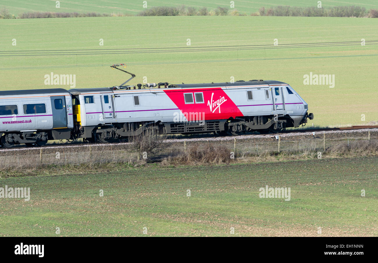 The new Inter City East Coast franchise Virgin and Stagecoach electric locomotive in the new red and grey livery. Stock Photo