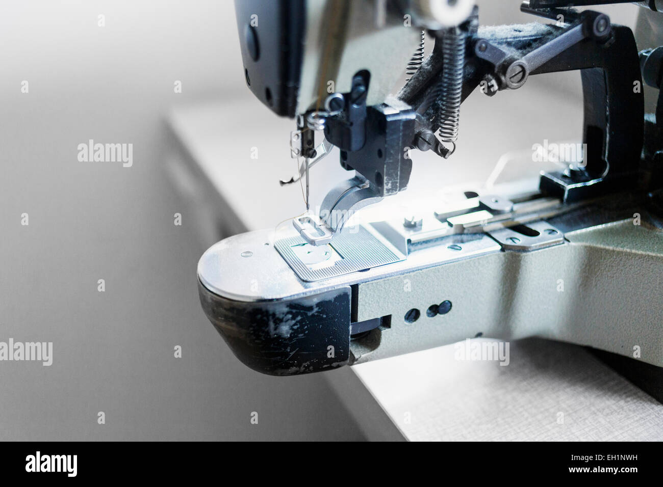 Close up sewing machine jeans factory hires stock photography and
