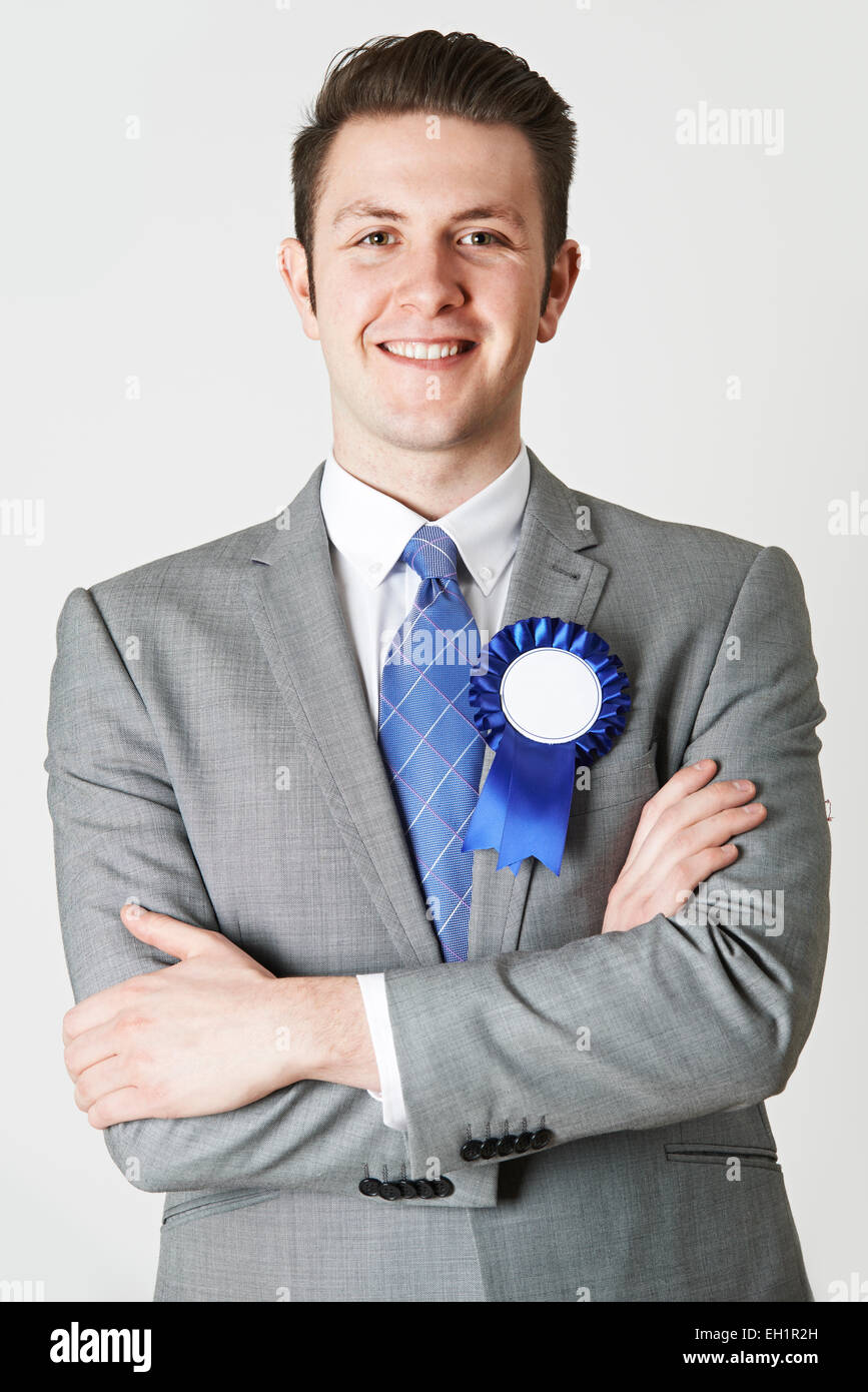 Portrait Of Politician Wearing Blue Rosette Stock Photo