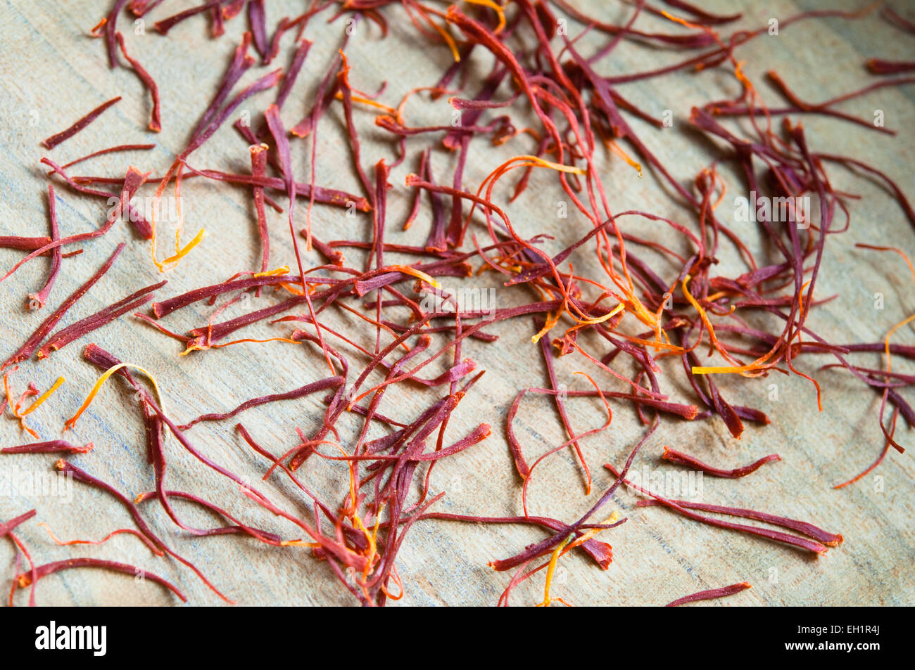 Close up view of Saffron Threads in an Olive Wood Bowl Stock Photo