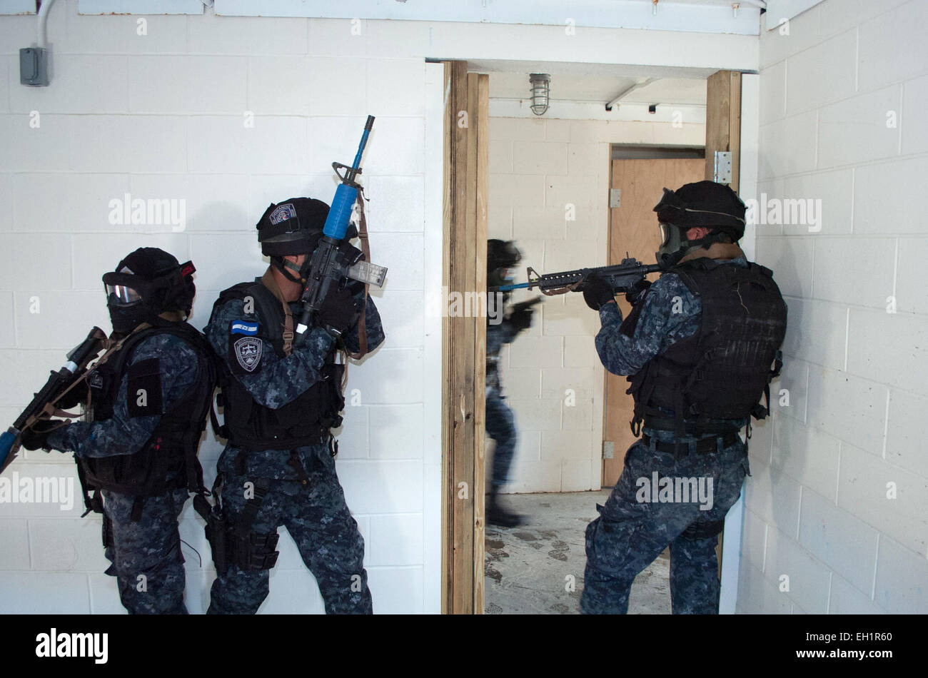 Honduran TIGRES special operation soldiers clear a compound during training February 27, 2015 at Eglin Air Force Base, Florida. Stock Photo